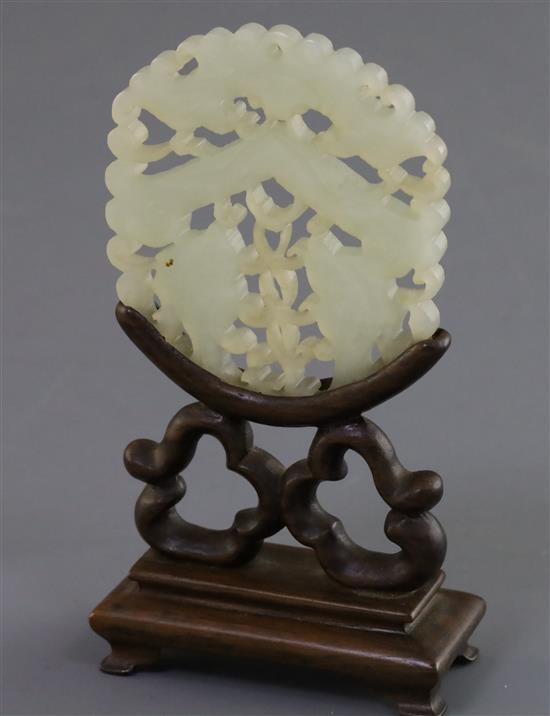 A Chinese pale celadon jade fish plaque, 19th century 6cm, wood stand